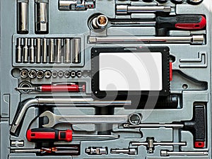 A collection of various hand tools arranged neatly in a toolbox.