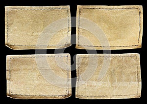 Collection of various jeans labels on black