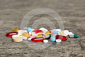 Collection Of Various Medical Tablets And Pills. Assorted pharmaceutical medicine pills, tablets and capsules on table