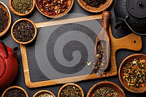 A collection of various teas nestled in wooden bowls