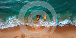 A collection of vibrant surfboards is lined up neatly on a sandy beach, adding a pop of color against the backdrop of