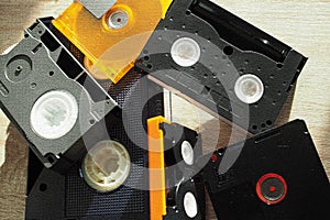 Collection of vintage media cartridges, including 8mm data cartridge, VHS-C, MiniDisc, MiniDV