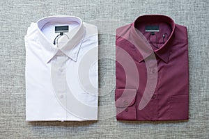 A collection of violet folded men`s shirts