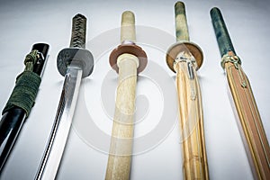 A collection of weapons for training, equipment for Japanese sport Iaido and Kendo. Wood, bamboo and steel sword.