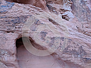 Collections of ancient petroglyphs of man and sun on sandstone
