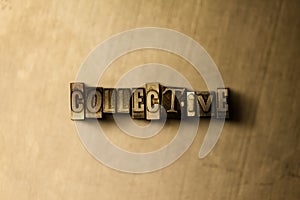 COLLECTIVE - close-up of grungy vintage typeset word on metal backdrop photo