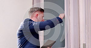 Collector Bailiff Knocks on Debtors Door photo