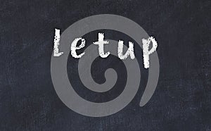 College chalk desk with the word letup written on in