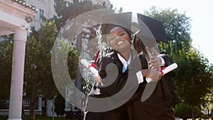 In the college garden amazing two best friends ladies students graduates posing with the smartphone taking pictures they