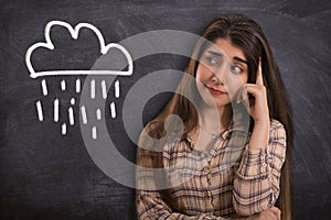 College girl thinking with cloud and rain