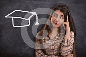 College girl thinking with Graduation cap