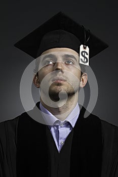 College graduate with tuition price tag, vertical