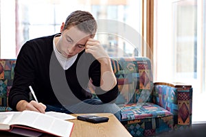 College Guy Studying Doing Homework photo