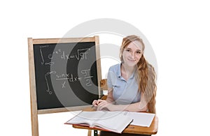 College student by blackboard studying math exam