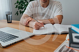College student at campus while studying online learning for pass exam to university