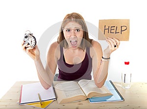 College student girl in stress asking for help holding alarm clock time exam concept