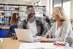 College Student Has Individual Tuition From Teacher In Library