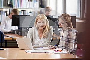 College Student Has Individual Tuition From Teacher In Library