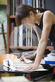 College Student Researching In Library