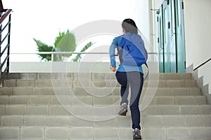 College student running up stairs