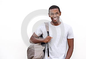College student smiling with bag