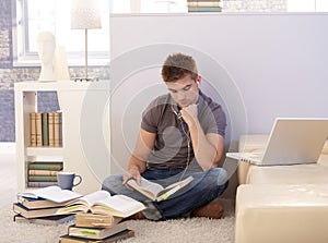 College student studying at home