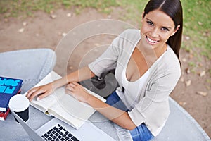 College student, studying and portrait of woman in park with book, laptop and coffee on campus. University, person and