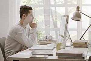 College student using computer at home