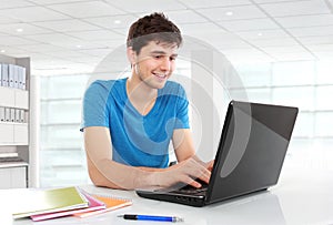 College student using his laptop