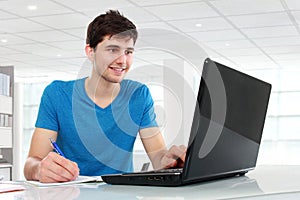 College student using his laptop