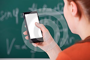 College student using smart phone in classroom