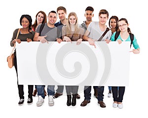 College students displaying blank billboard