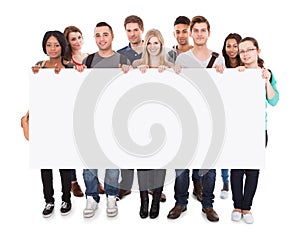 College students displaying blank billboard