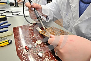 College students in electrical engineering in the classroom