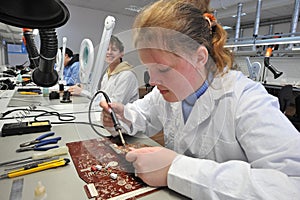 College students in electrical engineering in the classroom