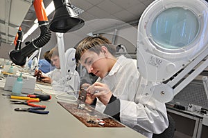 College students in electrical engineering in the classroom