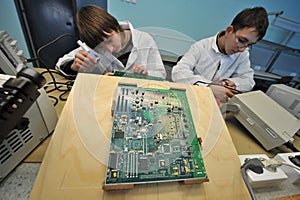 College students in electrical engineering in the classroom