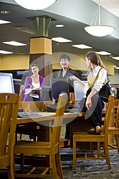 College students hanging out by library computers