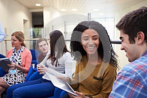 College Students Having Informal Meeting With Tutors photo