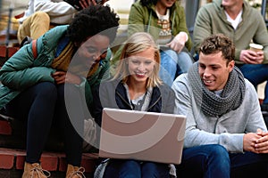 College, students and laptop on stairs outdoor for research, relax or break on campus with social media. University