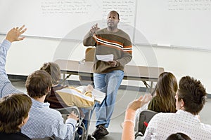 College Students And Professor In Classroom