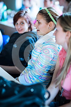 College students sitting in a classroom during class