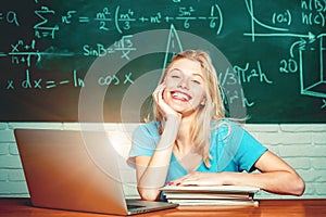 College students studying. Education. Student girl reading a presentation on laptop. Education study abroad. Female