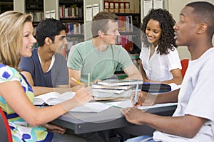 College students studying together in a library