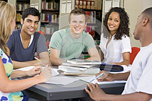 College students studying together in a library photo