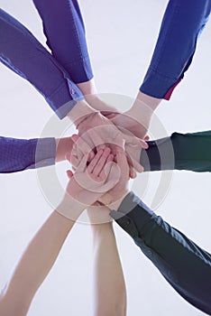 College Students Teamwork Stacking Hand Concept. Close up of young people putting their hands together. Friends with stack of