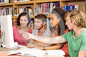 College students using computer in library