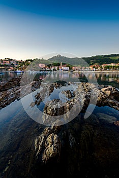 Collioure bay with rocks and beach at sunrise in France