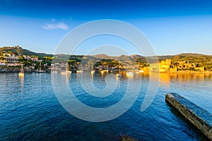 Collioure city with boats and medieval castle at morning in France