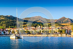 Collioure city and harbor with boats and morning lights in France